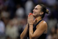 | Photo: AP/Seth Wenig : US Open Tennis Semifinal 2024: Aryna Sabalenka, of Belarus, smiles after defeating Emma Navarro